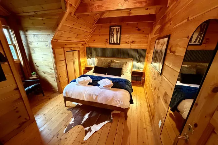 Second-floor queen bedroom with a cozy reading nook.