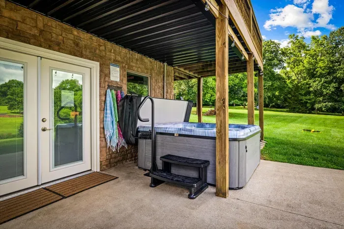 Relax in the new 7-person hot tub just outside the double king room.