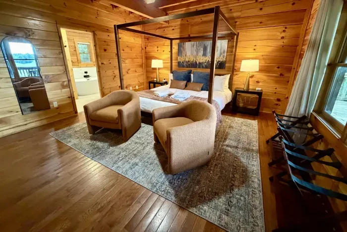 Main-floor primary suite with a king bed and private ensuite bathroom.