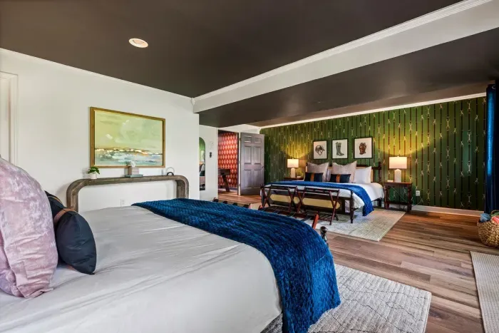 Spacious basement bedroom featuring two king beds.