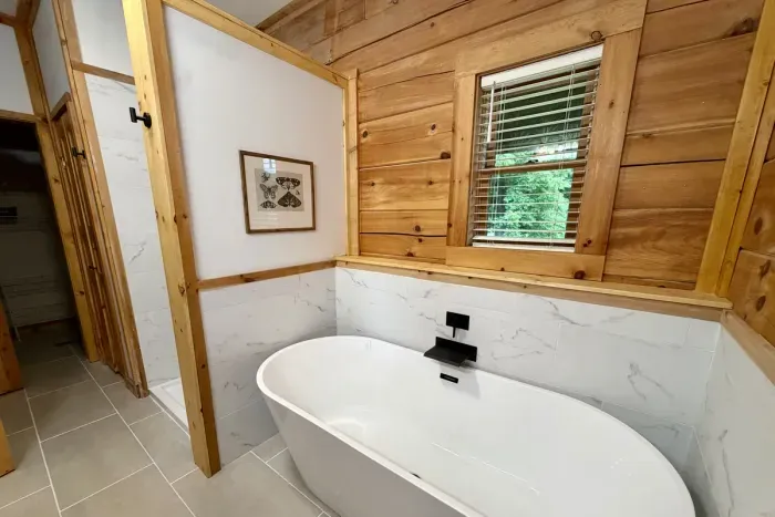 Newly renovated bathroom with a soaking tub and walk-in shower.