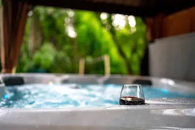 Relax in the hot tub with convenient built-in drink holders