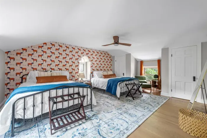 This bedroom has two queen beds