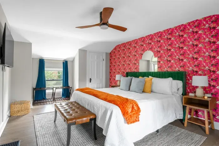 Enjoy the king size bed and colorful wallpaper