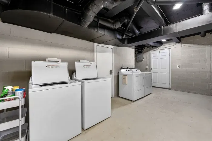 The laundry room is located in the basement - yes there are two washers and two dryers!