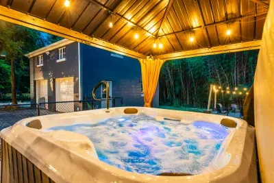 Relax year-round in the covered hot tub in the backyard