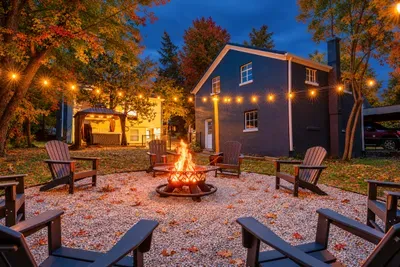 Sip your favorite beverage by the fire under glowing string lights