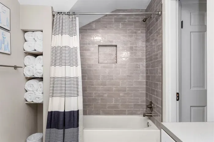 The bathroom has plenty of towels