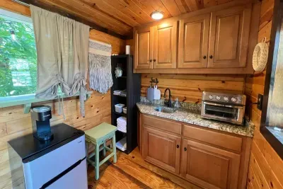A mini-fridge with freezer, space for a pint of ice cream for your your midnight snack!