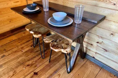 This tiny table folds out for a meal and folds back up for added room.  Plenty of dishes, glassware and utensils for your stay.