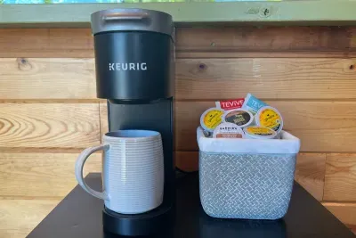 A K-mini-Keurig, a variety of coffees and creamer or just heat up some water for a cup of tea. Start your day off right!