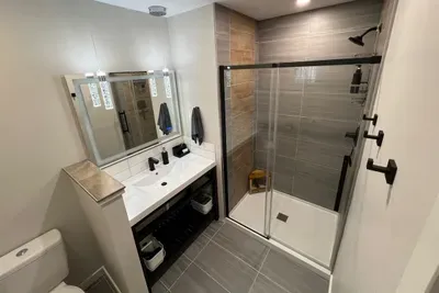 This fully tiled walk-in shower provides a spa-like feel. Our fluffy white towels and our butter soft hand towels and wash cloths are hit with all our guests.
