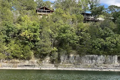 From the lake the home sits high above for a perfect view!