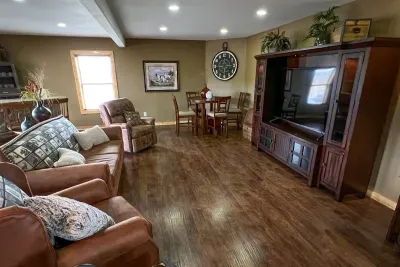 Gather round this 70" Samsung TV, stream your favorites using our Century Link wifi. Play a game of cards, make yourself a drink or just put your feet up and enjoy the show that's playing all around you, not just on the big screen!