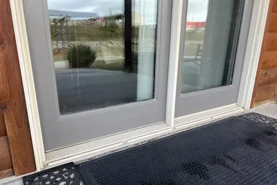 This entrance gives guests access to the first floor where there is a TV room, family room, kitchen, dining, bathroom, ensuite, laundry and half-bath.