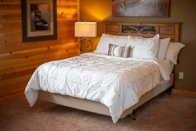 Welcome to "Bearadise"!  Our second 20' x 20' suite provides sweet dreams for six!  Don't you just want to crawl in and hibernate!  Get" it!   Hibernate in "Bearadise". We don't charge extra for the humor.