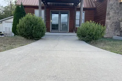 First floor entrance gives access to TV room, living room, dining, kitchen, main en-suite and back deck.