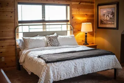 Another King in the palace! Again a brand new Stearns and Foster king size mattress and luxurious comforter offer the comfort of a high end hotel in the relaxing beauty of a lake retreat. We value the importance of sleep! Sleep tight!
