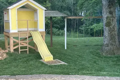 A backyard big enough for the littles to be entertained by swings and slide, so the not-so-littles can relax and enjoy.  The kids love it and the parents and grandparents love it because is a safe and secluded area just off the back deck.