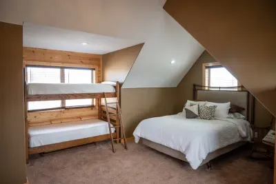 The queen and bunks are both tucked away into their cozy dens.  You'll feel sleepy and serene when you are all snuggled up and tucked in for the night. Sleep well in "Bearadise"!!