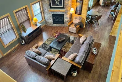 From this vantage point not only can you see how spacious the great room is you can also see how it sits right next to the media room that provides two game tables for 4 people, a bar in the corner for the life of the party and a giant TV!