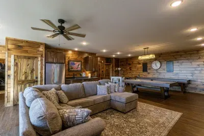 Game room with pool table, two arcade tables, XBOX, shuffleboard, and poker table.  Extra refrigerator also available so you can enjoy without a separate trip to the kitchen!