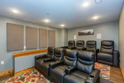 Comfy seating in our theater room!  Enjoy the 85" SmartTV!