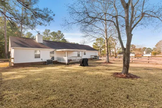 The fenced back yard helps you keep an eye or children or pets while relaxing on the porch.