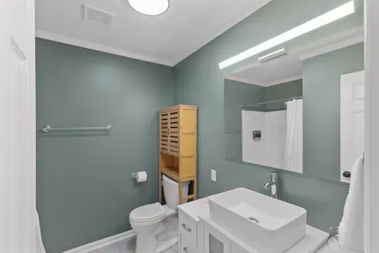 Shared bathroom with single vanity