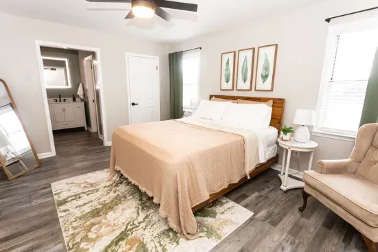 Large bedroom with sitting area and  private bath and smart TV