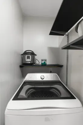 Laundry Room With New High Capacity Washer and Dryer
