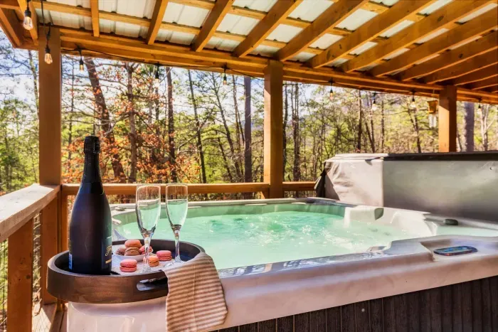 The serene back deck has a 6 seater hot tub and lounge area.