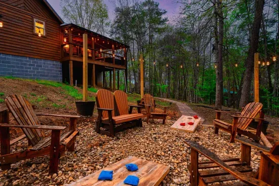 Beautiful conversation pit with ambient string lights! Perfect area for cornhole.