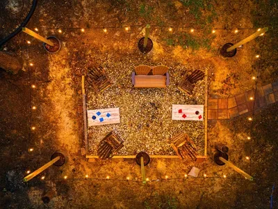 Aerial view of conversation pit and corn hole area.