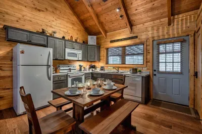 The kitchen is fully stocked and has a dining table with room for at least 6.