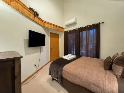 Queen bed with TV