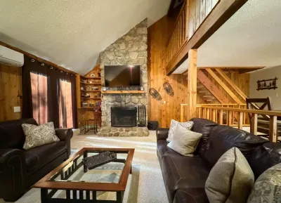 Cozy living room with a huge TV and an indoor fireplace