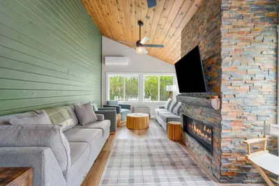 The main living room features a cozy gas fireplace, perfect for unwinding after a day outdoors.