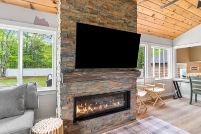 The main living room features a cozy gas fireplace, perfect for unwinding after a day outdoors.