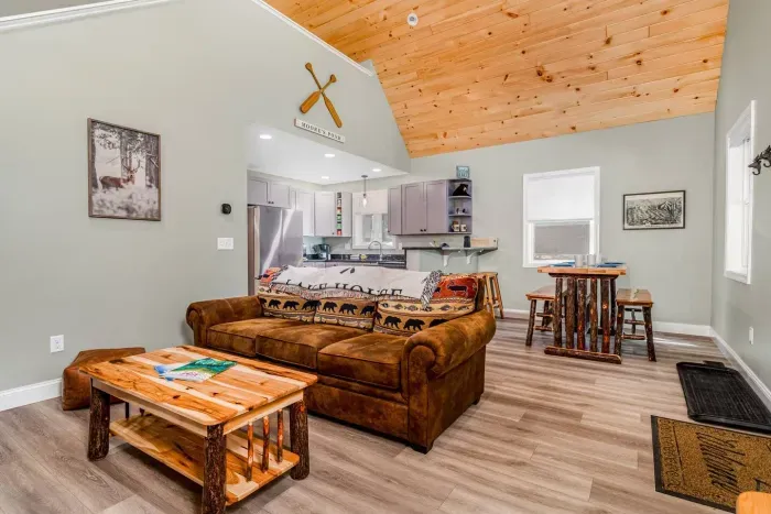 The living room is open concept with the dining/kitchen area. Features a gas fireplace!