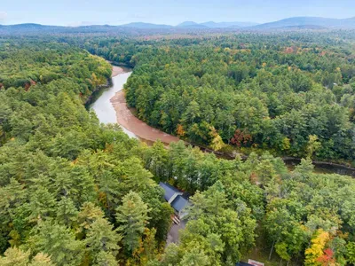 Private riverside retreat surrounded by peaceful forest.
