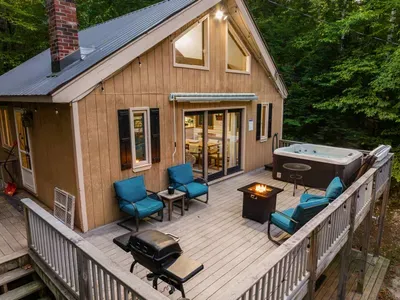 Deck - with fireplace, hot tub, outdoor seats, and grill