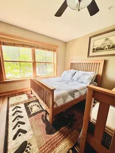 1 queen bed and a bunk bed