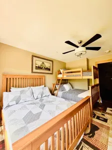 1 queen bed and a bunk bed