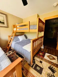 1 queen bed and a bunk bed