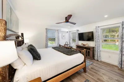 King bed with AC, and TV.