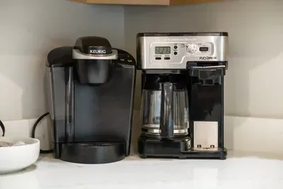 These are two coffee makers — a Keurig single-serve coffee machine (left) and a Hamilton Beach FlexBrew coffee maker (right), which can brew both ground coffee and K-Cups.