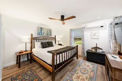 King bed with AC, and TV.