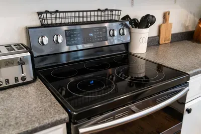 Guest-ready kitchen with modern appliances.