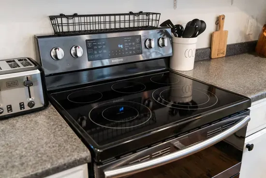 Guest-ready kitchen with modern appliances.